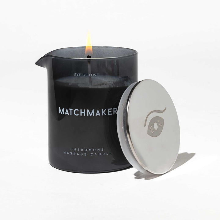 Lit Eye of Love's Matchmaker Black Diamond pheromone massage candle