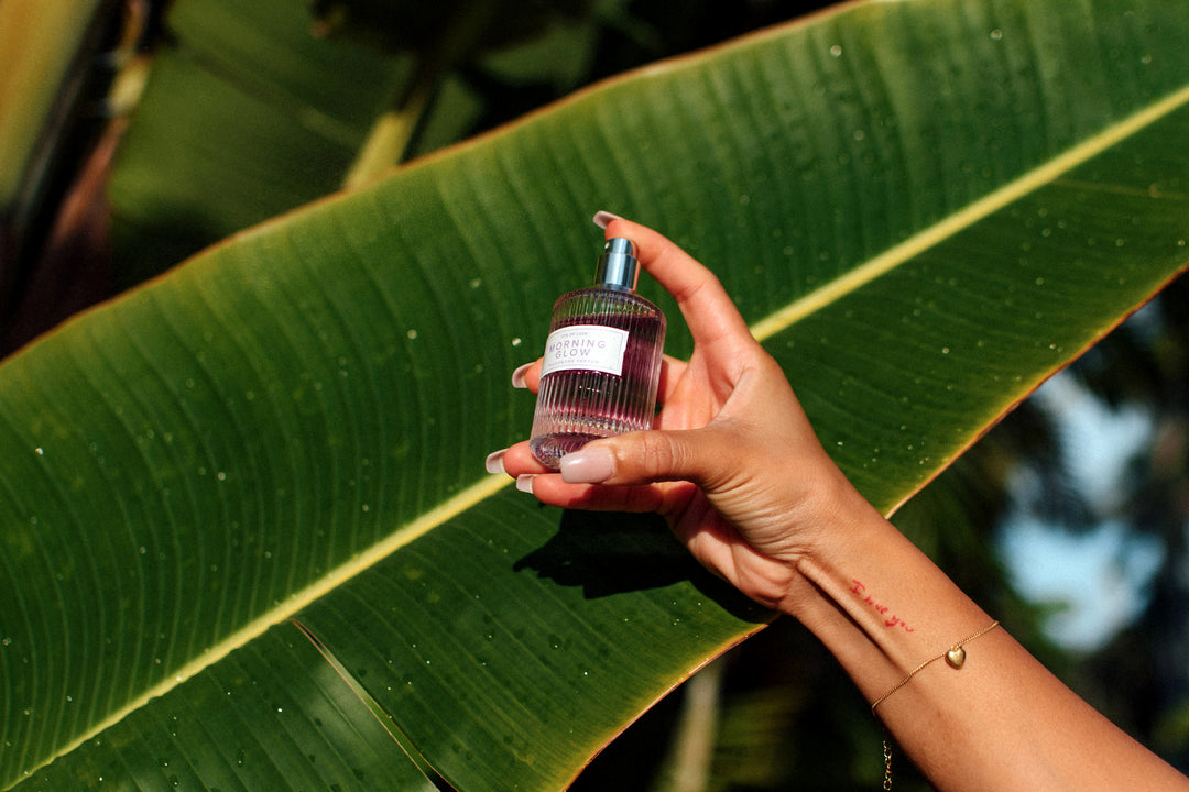 Hand holding Morning Glow pheromone perfume