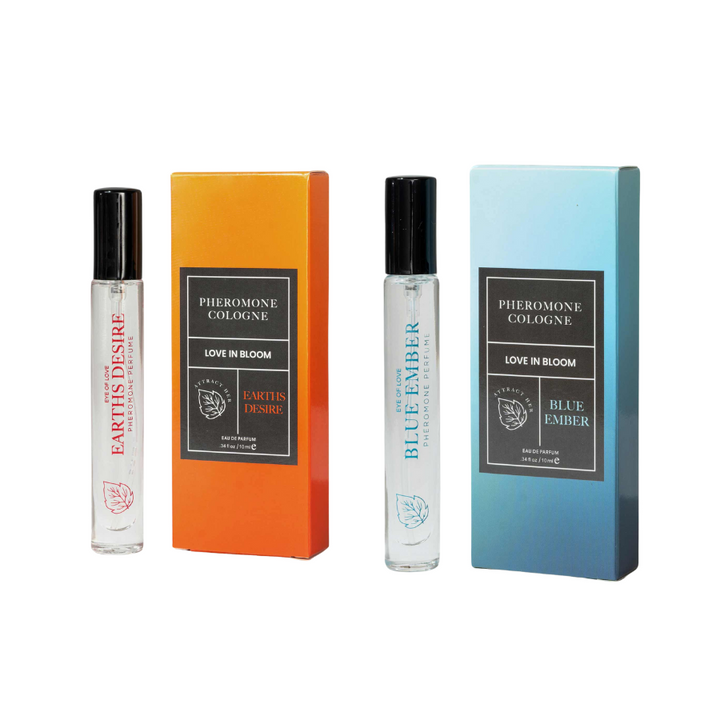 Eye of Love's travel-size pheromone scents Earths Desire and Blue Ember, with bottles standing beside their packaging