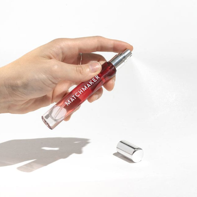 Hand holding Matchmaker perfume