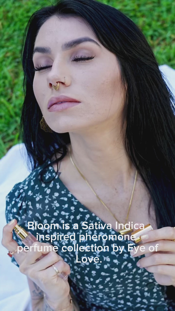 Female with long black hair and a nose ring using Eye of Love's Bloom Collection pheromone perfume.