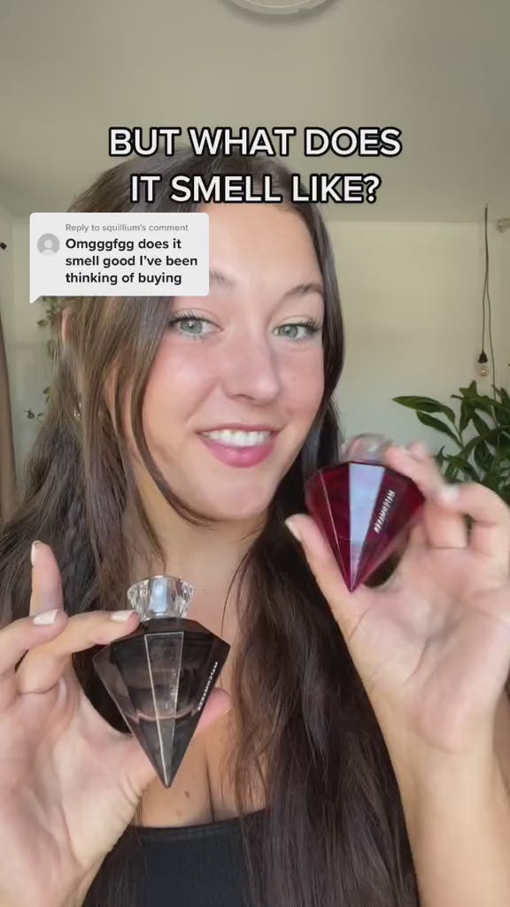 Video of a woman holding a bottle of Eye of Love's Matchmaker pheromone scent in Red Diamond and Black Diamond.